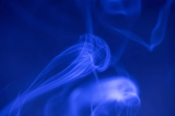 Smoke Clouds Swirling Blue Light Dark Background — Stock Photo, Image
