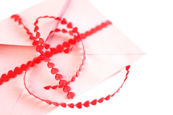 Envelope with red hearts ribbon — Stock Photo, Image