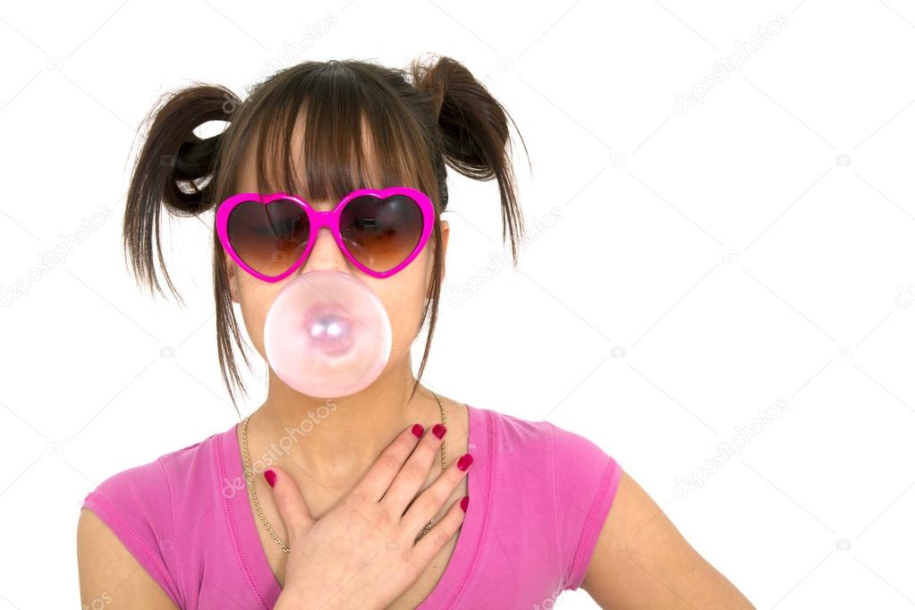 Teen blowing a chewing gum