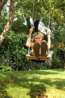 Girl on swing clipart