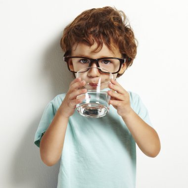 Boy drinking a glass of water