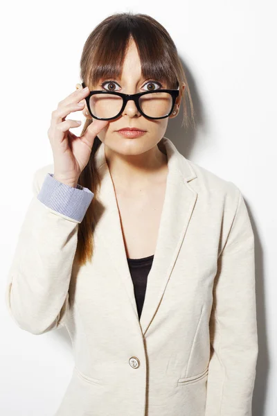 Beautiful business woman with surprised face holding a glasses — Stock Photo, Image