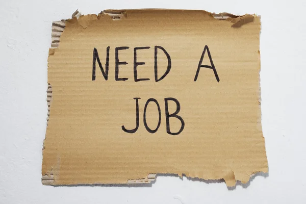 Cardboard that says need a job — Stock Photo, Image