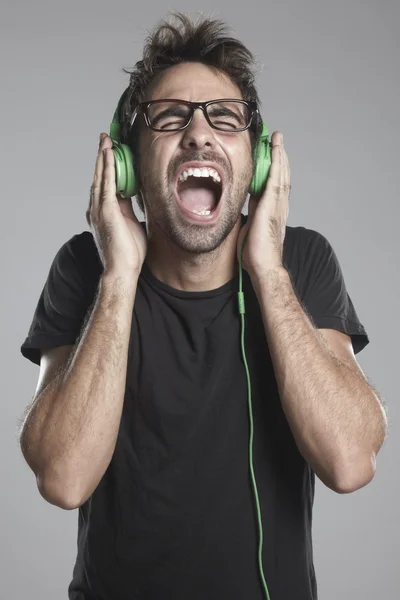 Squealing boy with headphones — Stock Photo, Image