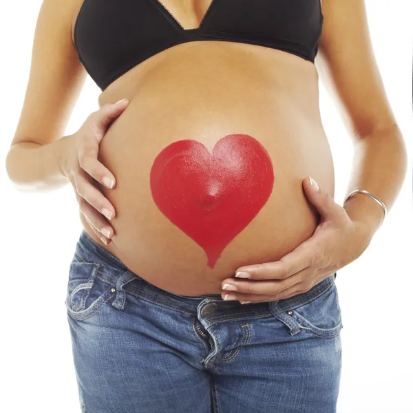 Jovem grávida com uma audição na barriga — Fotografia de Stock