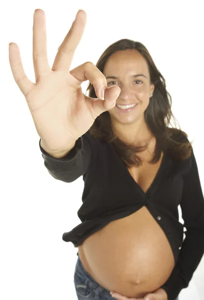 Beautiful young pregnant woman doing OK sign — Stock Photo, Image