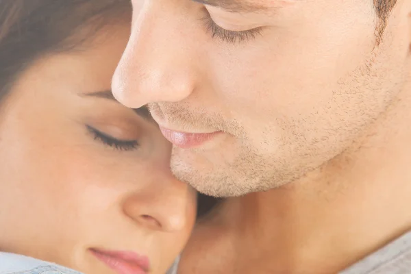 Closeup of young couple embraced — Stock Photo, Image