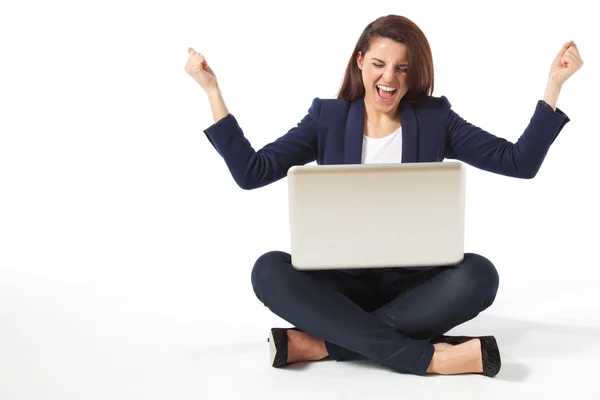 Stressed young businesswoman with laptop Stock Picture