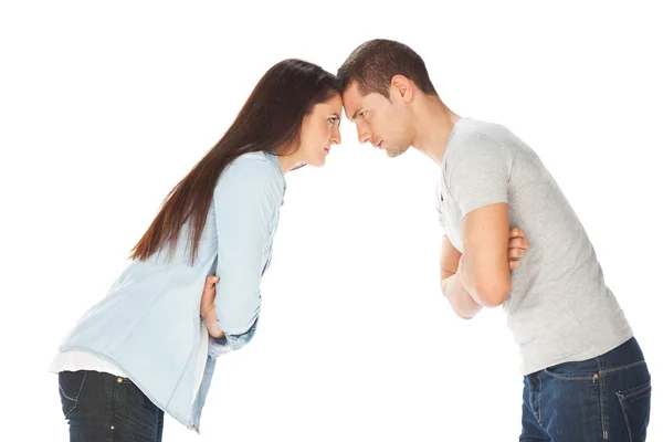 Young couple staring at each other and crossed arms — Stock Photo, Image