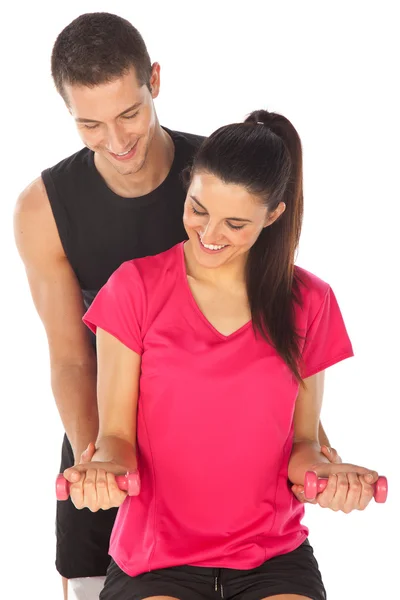 Woman with her personal fitness trainer exercising with weights — Stock Photo, Image