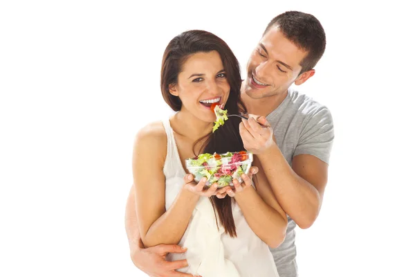 Joven hombre y mujer levantando pesas. Aislado sobre blanco — Foto de Stock