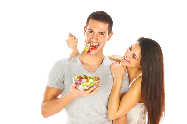 Joven hombre y mujer levantando pesas. Aislado sobre blanco — Foto de Stock