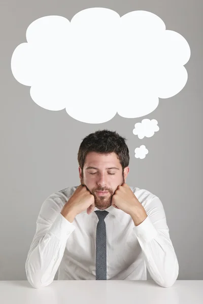 Portrait of a young businessman thinking. — Stock Photo, Image