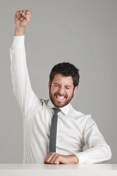 Portrait of a young businessman celebrating success. Stock Image