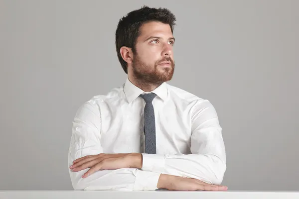 Portrait of a young businessman looking to the side. — Stock Photo, Image