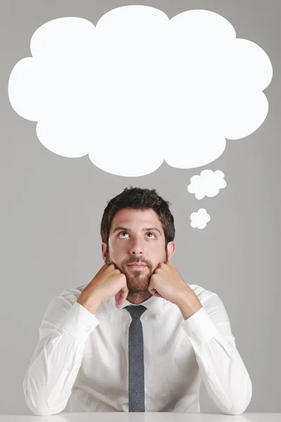 Portrait of a young businessman thinking. — Stock Photo, Image