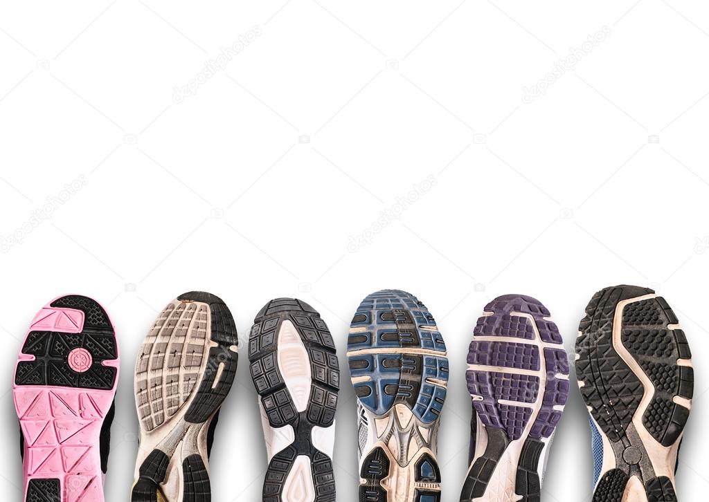 Different shoe sole on a grey background.