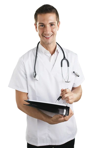 Joven médico con estetoscopio escribiendo en un cuaderno . — Foto de Stock