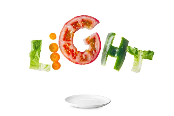 Leichter Salat mit fliegendem frischem Gemüse. lizenzfreie Stockfotos