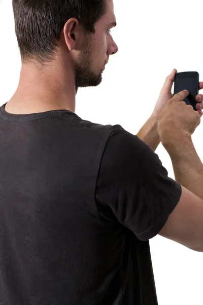 Jonge man aan het werk op zijn smartphone — Stockfoto