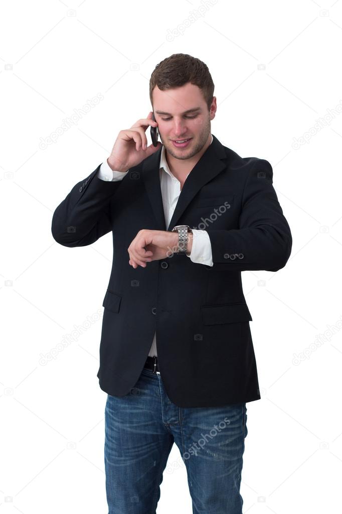 Young Man on the phone nd looking at watch