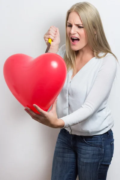 Woman destroying heart after breakup — Stock Photo, Image