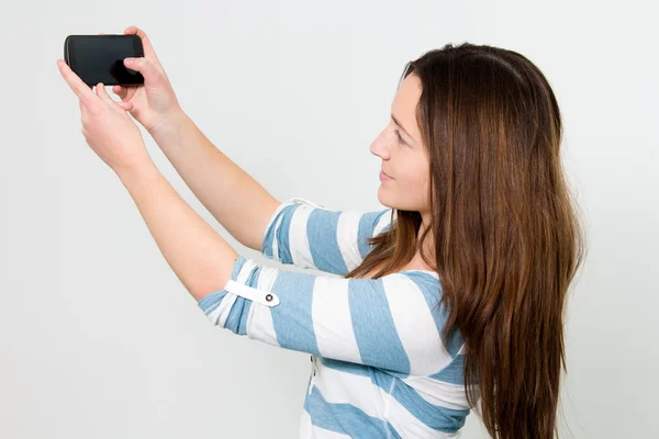 Brunette Girl using a Smartphone — Stock Photo, Image