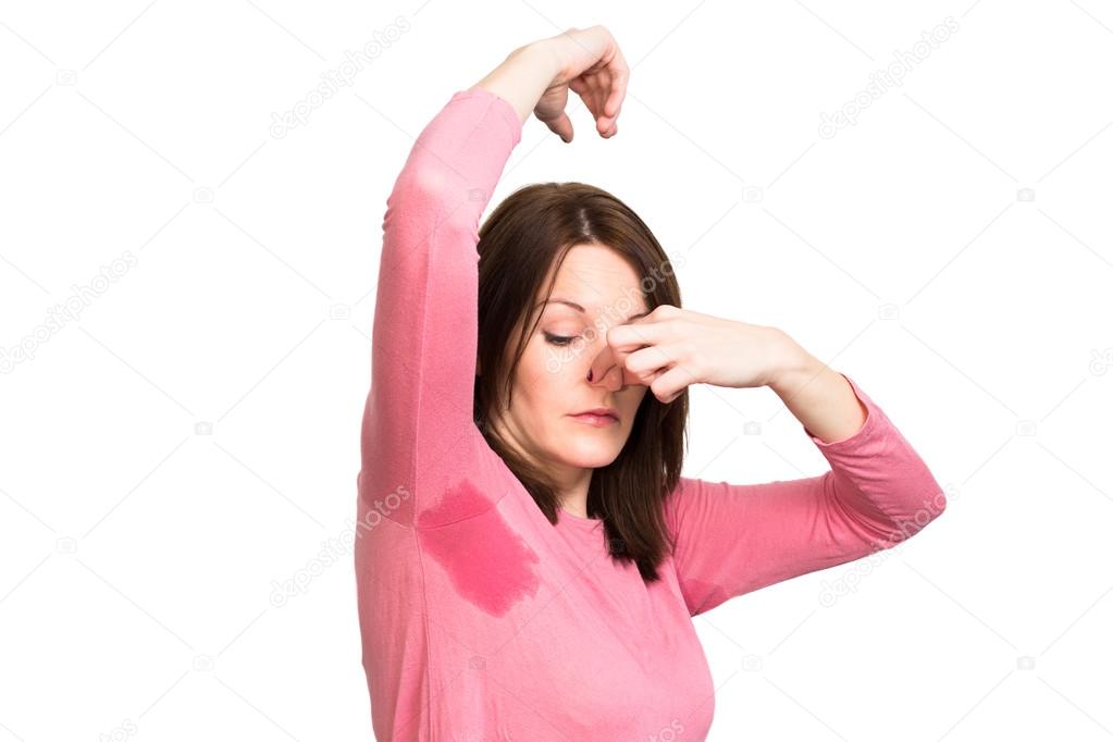 Woman sweating very badly under armpit