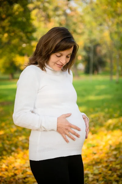 Expecting - pregnant woman outdoor — Stock Photo, Image