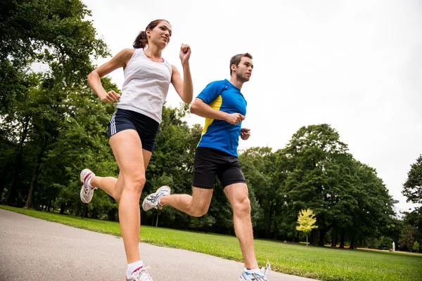 Jogging juntos - deporte joven pareja —  Fotos de Stock