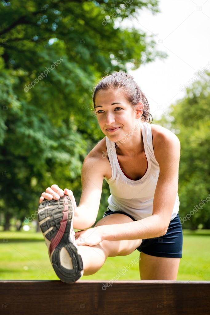 Stretching exercise - sport woman outdoor