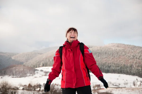 Winter portrait of senior mature in mountain snowy land — Stock Photo, Image
