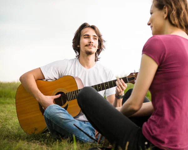 Playing guitar - romantic couple — Stock Photo, Image