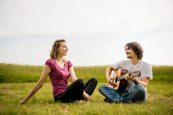 Playing guitar - dating couple — Stock Photo, Image