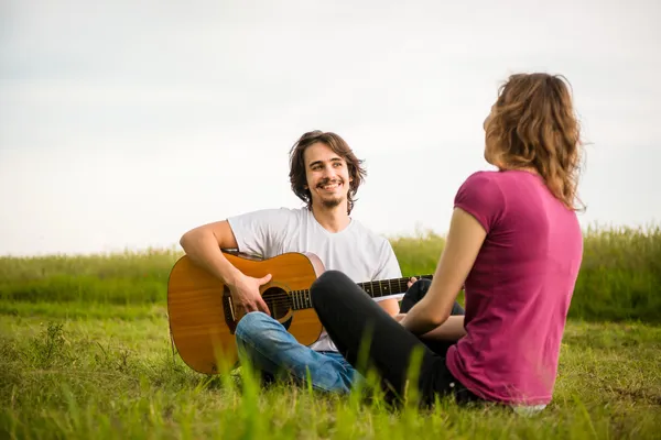 Playing guitar - dating couple — Stock Photo, Image