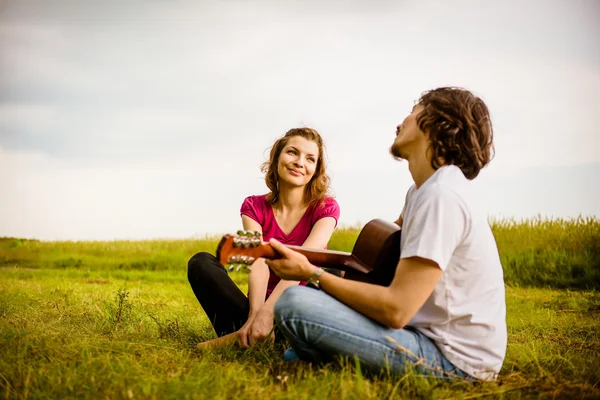 Playing guitar - romantic couple — Stock Photo, Image