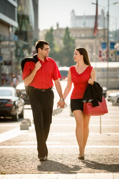 Happy business couple walking street — Stock Photo, Image