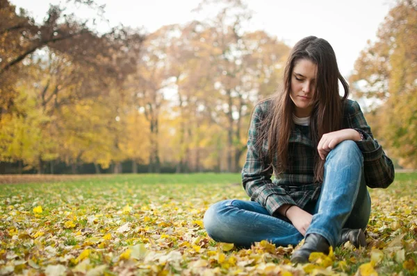 Young woman in depression outdoor — Stock Photo, Image