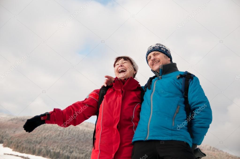 Winter fun - senior retired couple in snow