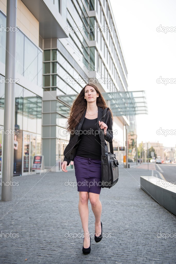 Business woman walking in hurry