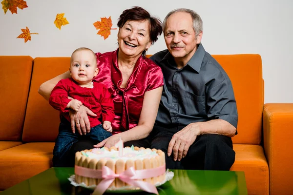 Happy retirement - first birthday of grandchild — Stock Photo, Image