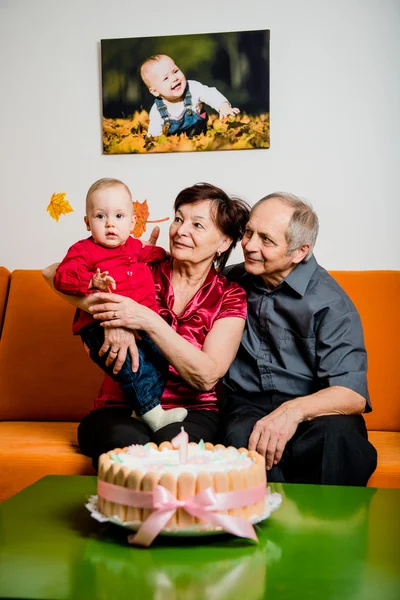 Happy retirement - first birthday of grandchild — Stock Photo, Image