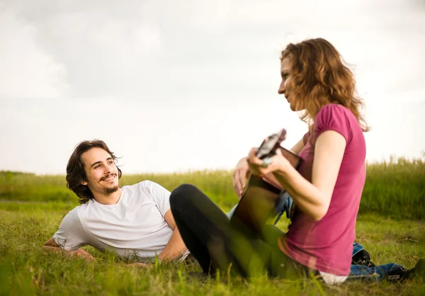 Playing guitar - romantic couple — Stock Photo, Image