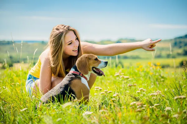 Teenager with her dog — Stok fotoğraf