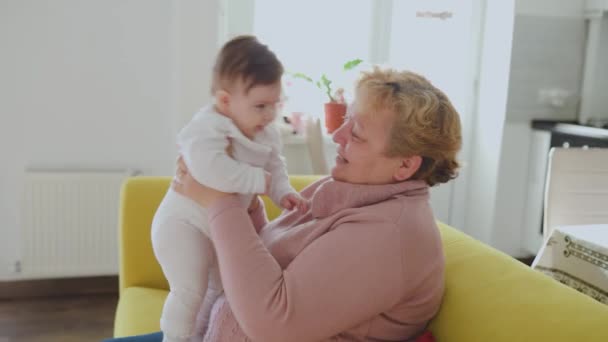 Grandmother with her cute granddaughter baby, — Stock Video