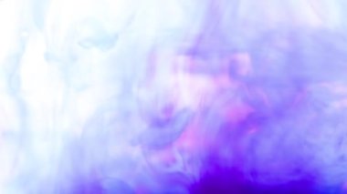 Real shot color vibrant ink paint drops in water in slow motion.