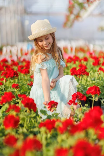 Pretty Girl Squatting Greenhouse Flowers Child Enjoys Beauty Aroma Flowers — Stock Photo, Image