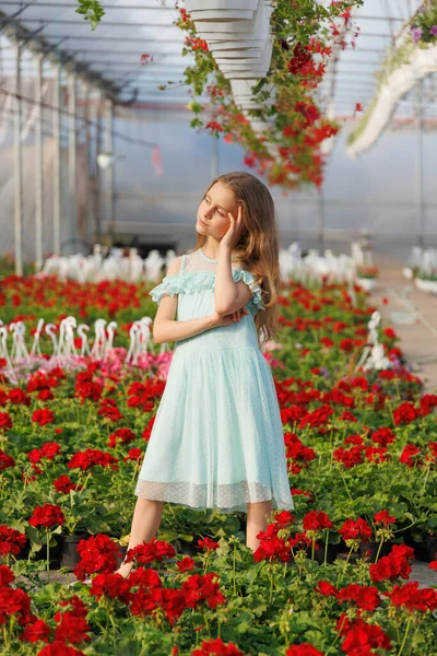 Beautiful Girl Stands Greenhouse Looks Distance Baby Wearing Turquoise Dress — Stock Photo, Image
