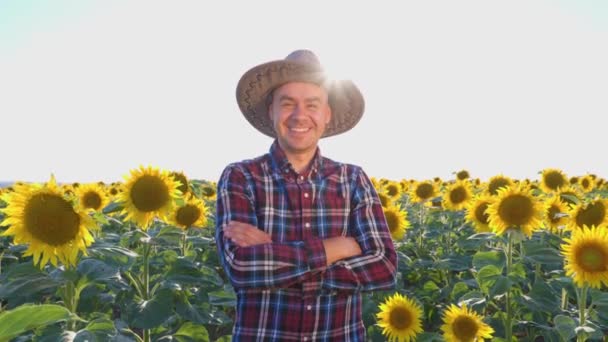 Happy Young Farmer Stands Field Sunflowers Man Crossed His Arms — 图库视频影像