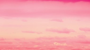 Time Lapse purple sky and vibrant clouds flowing amazing colorful clouds. Light white clouds fly across a bright cloud sky. Clear sky at sunny summer afternoon